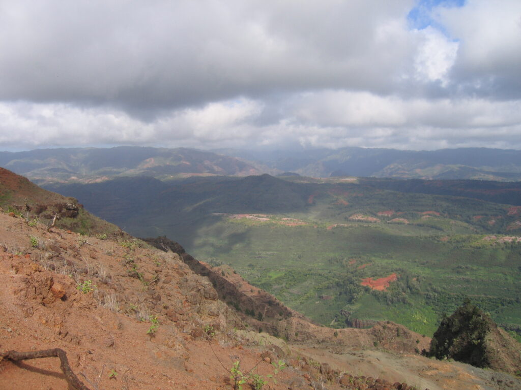 Mountain landscape with cloudy sky above valley.