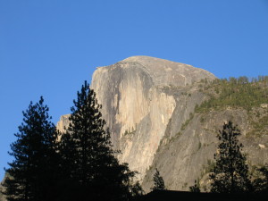 Half Dome rock formation under clear blue sky.