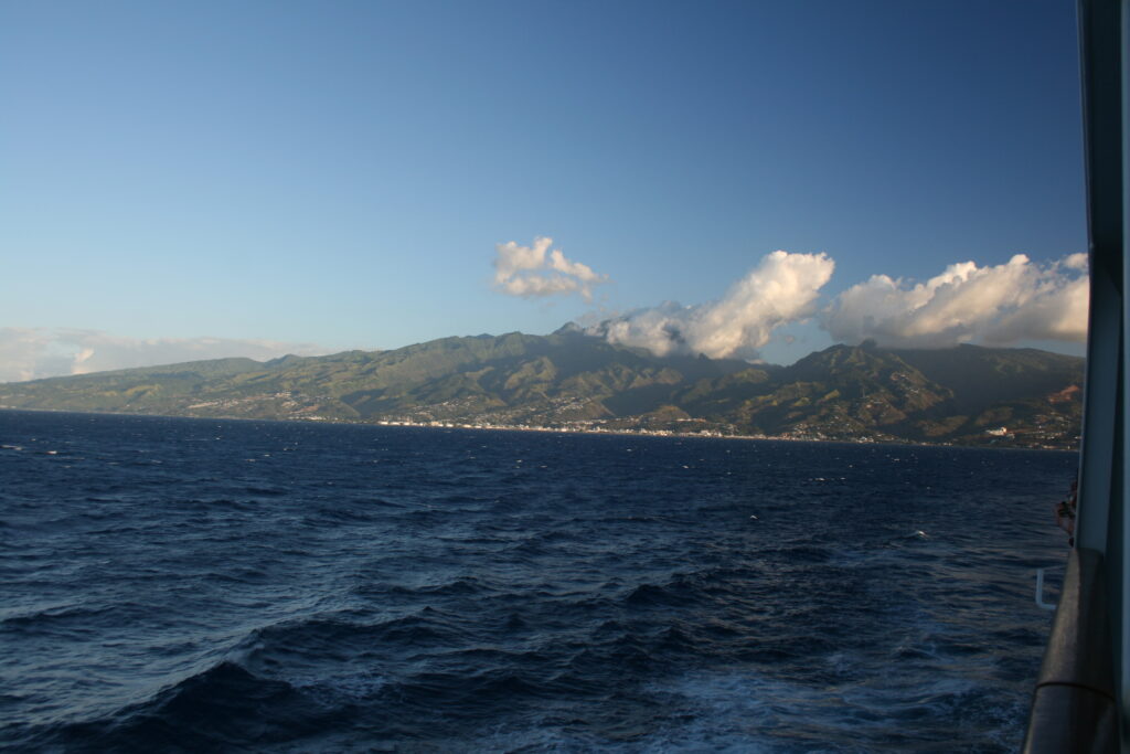 Ocean view with distant mountainous coastline.
