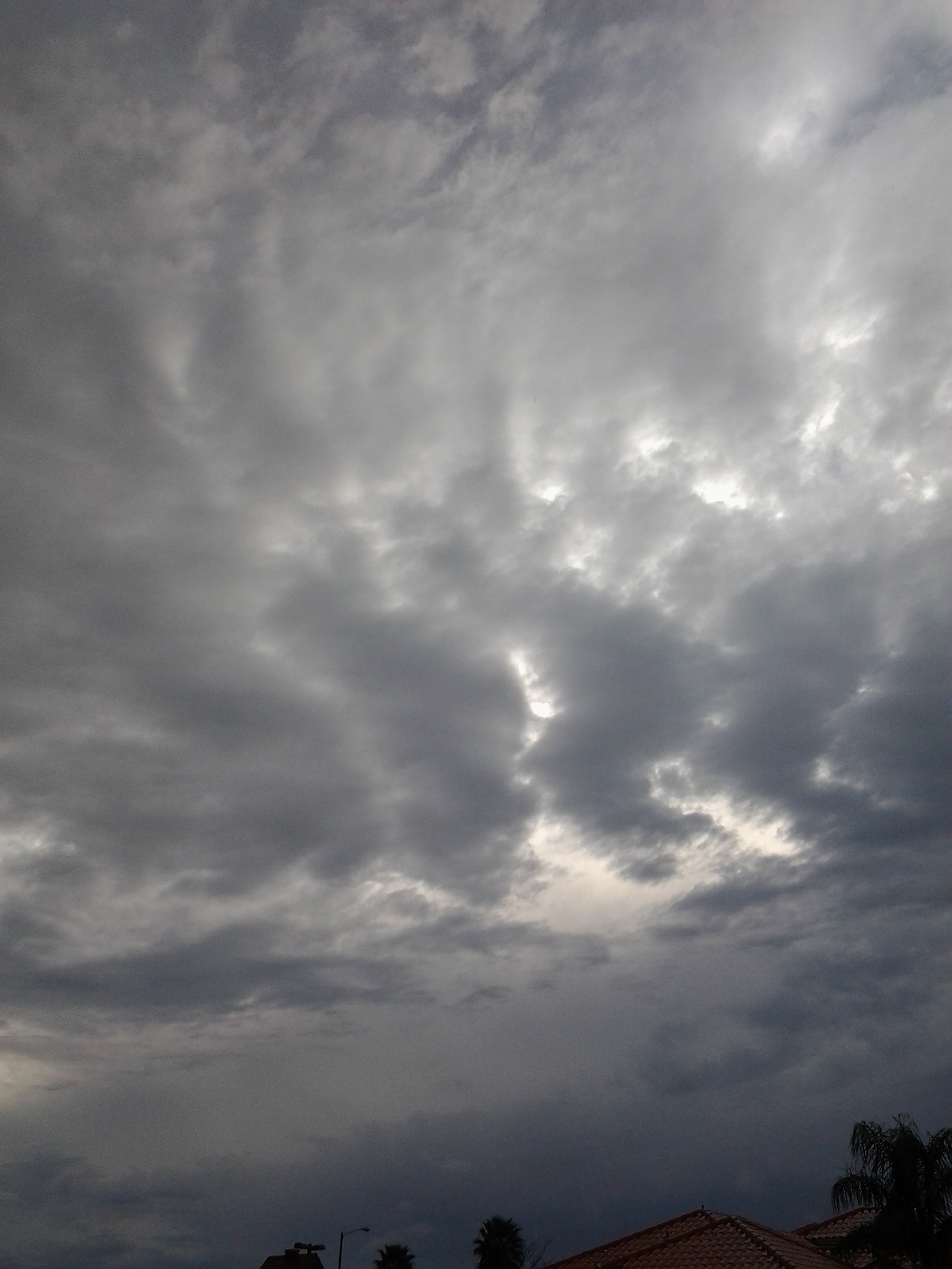 Cloudy sky with dark, dramatic clouds.