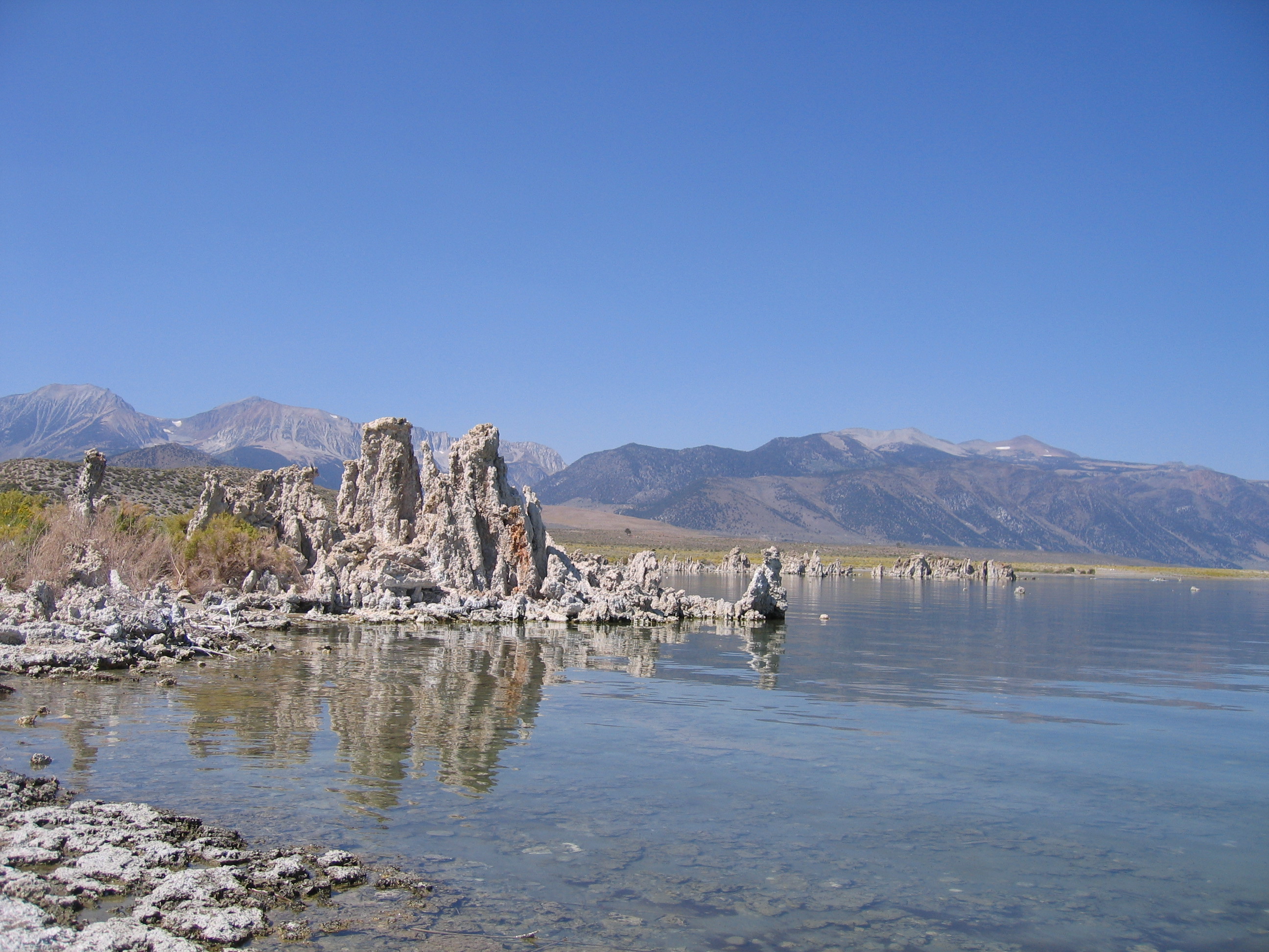 Mono Lake with tufa formations and mountains.