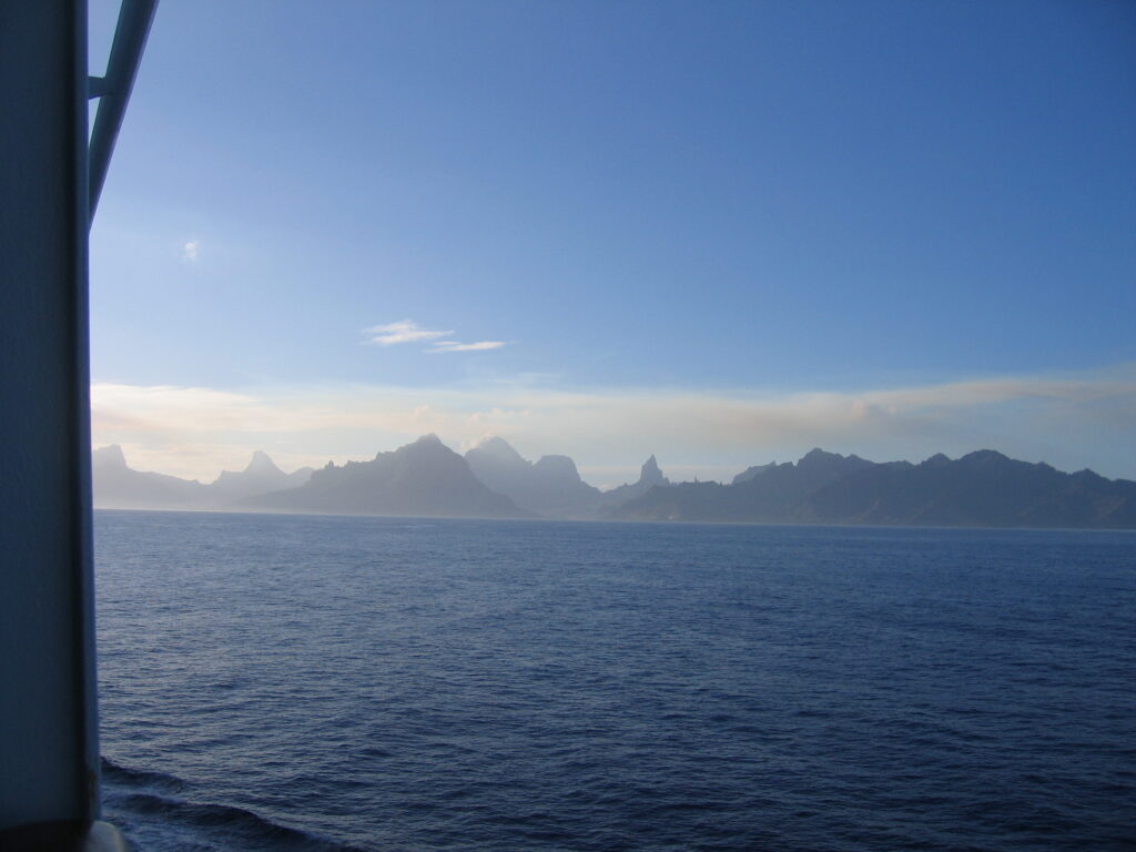 Ocean view with distant mountain silhouette.