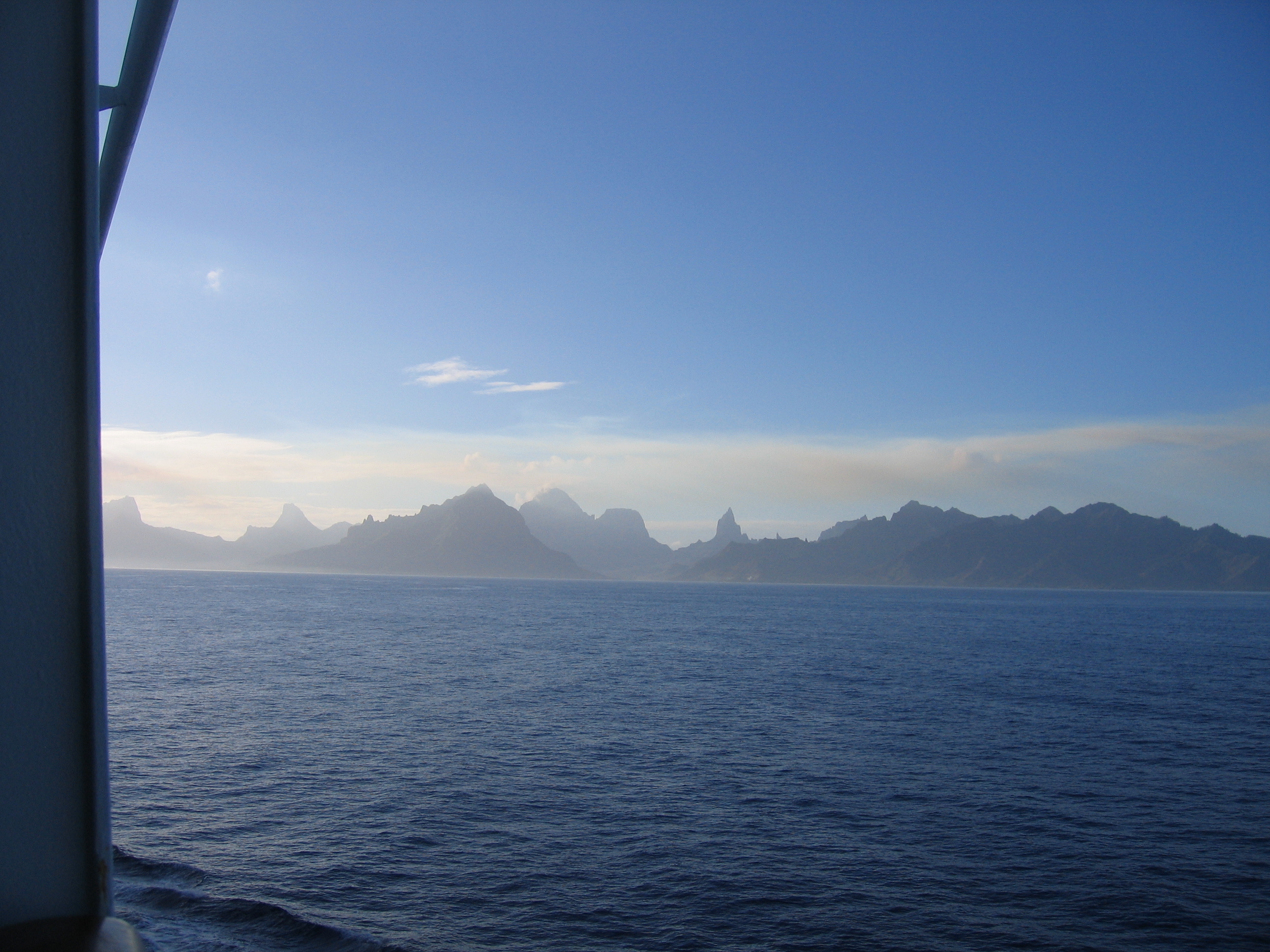 Ocean view with distant mountain silhouette.