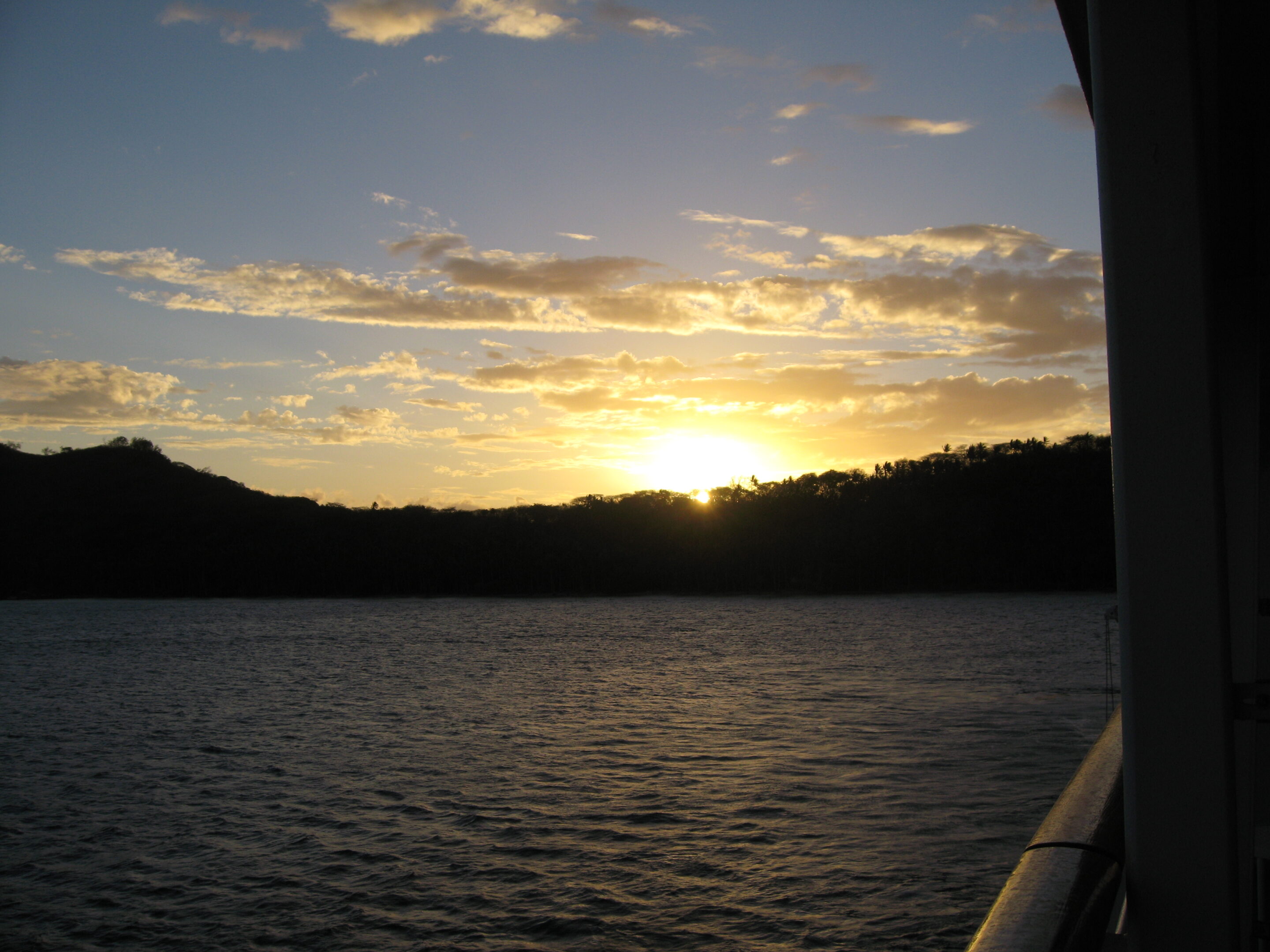 Sunset over a calm ocean view.