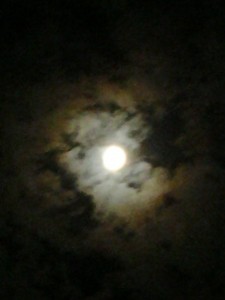 Appealing to my eyes, Beautiful full Moon surrounding by clouds.