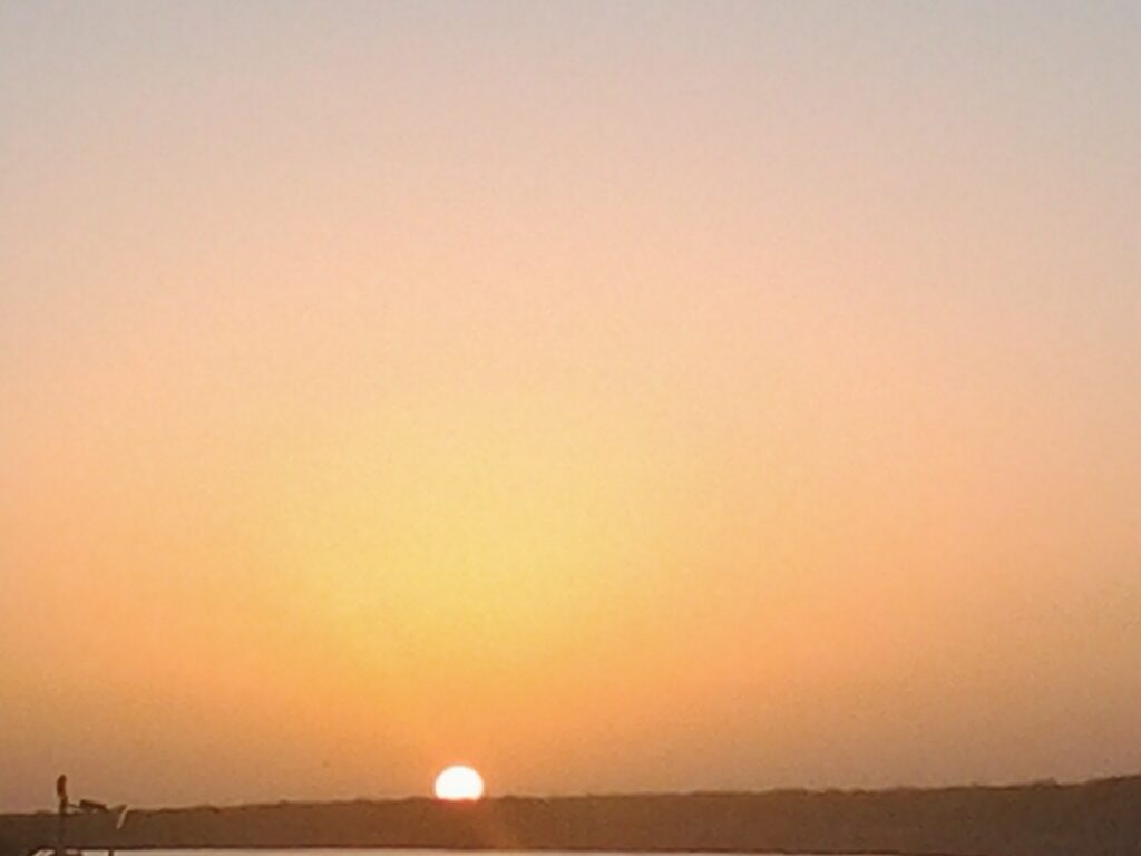 Sunset over a calm horizon.