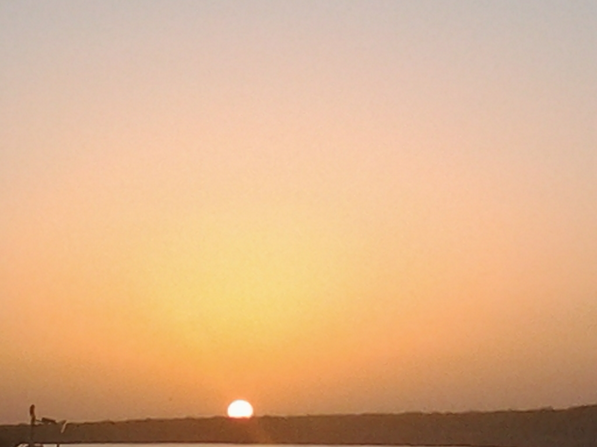 Sunset over a calm horizon.