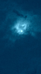 Blue clouds surrounding the Moon