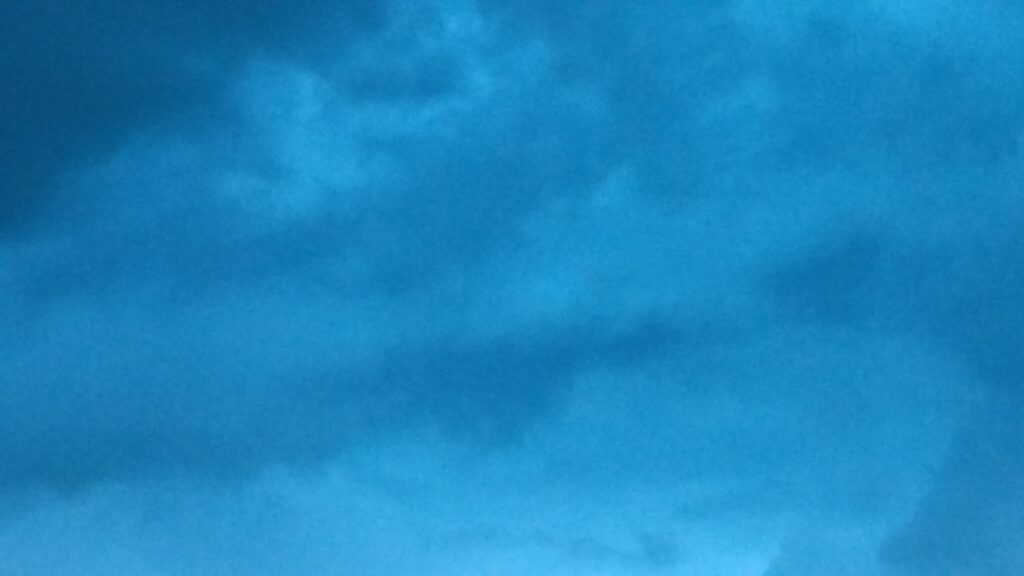 Blue cloudy sky with soft lighting.