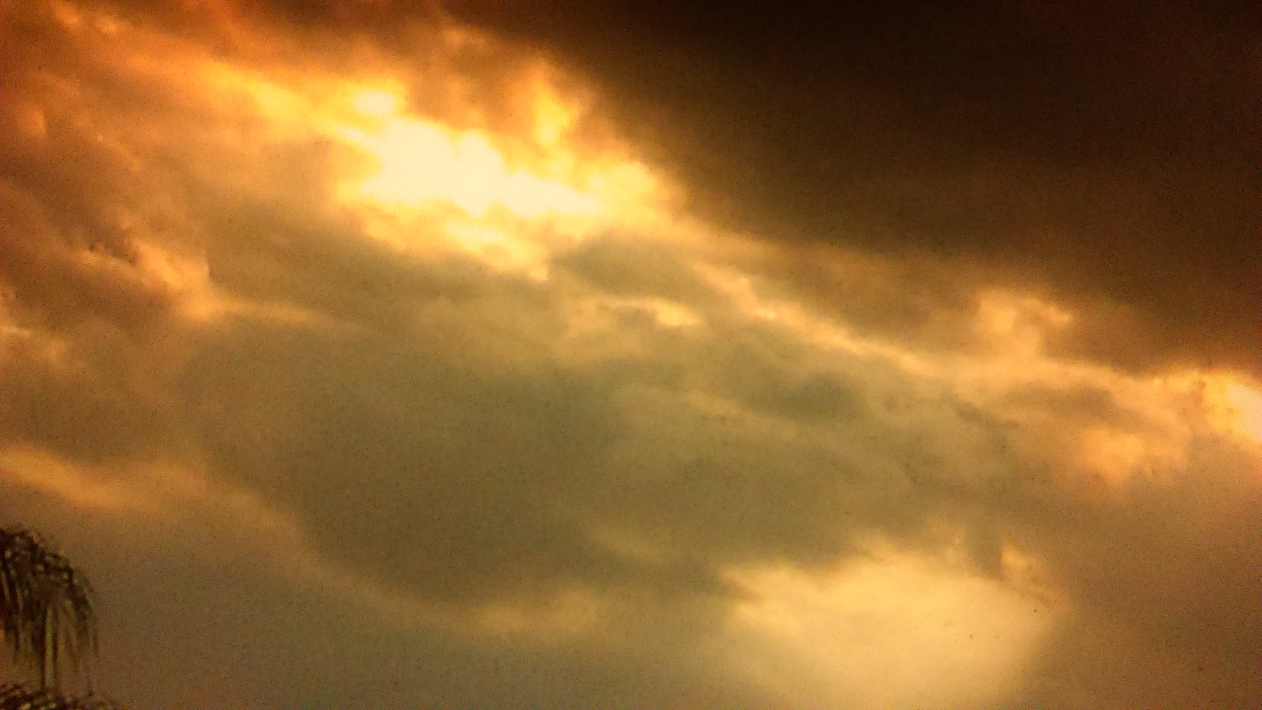 Dramatic cloudy sky with golden light.