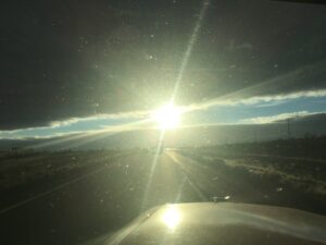 Sunset over a rural highway road.