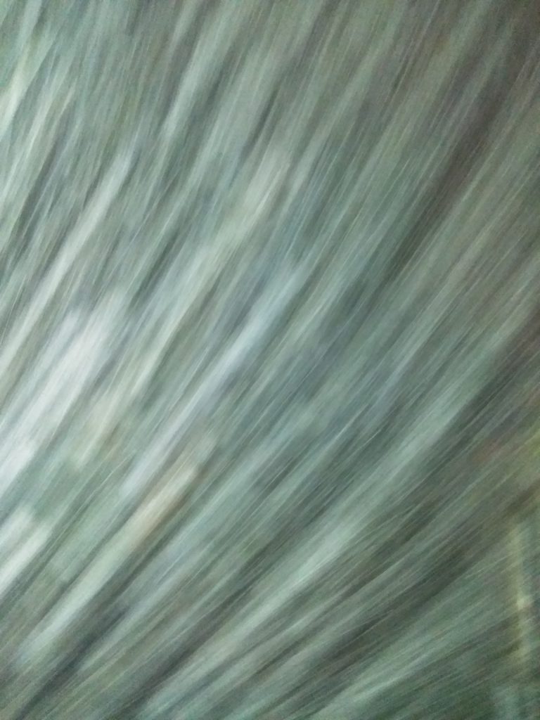 Blurred abstract green and gray texture.