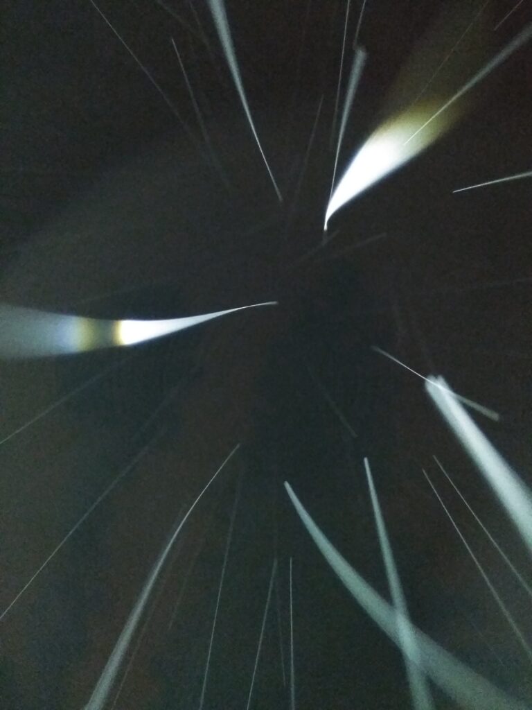 Abstract light streaks on dark background.