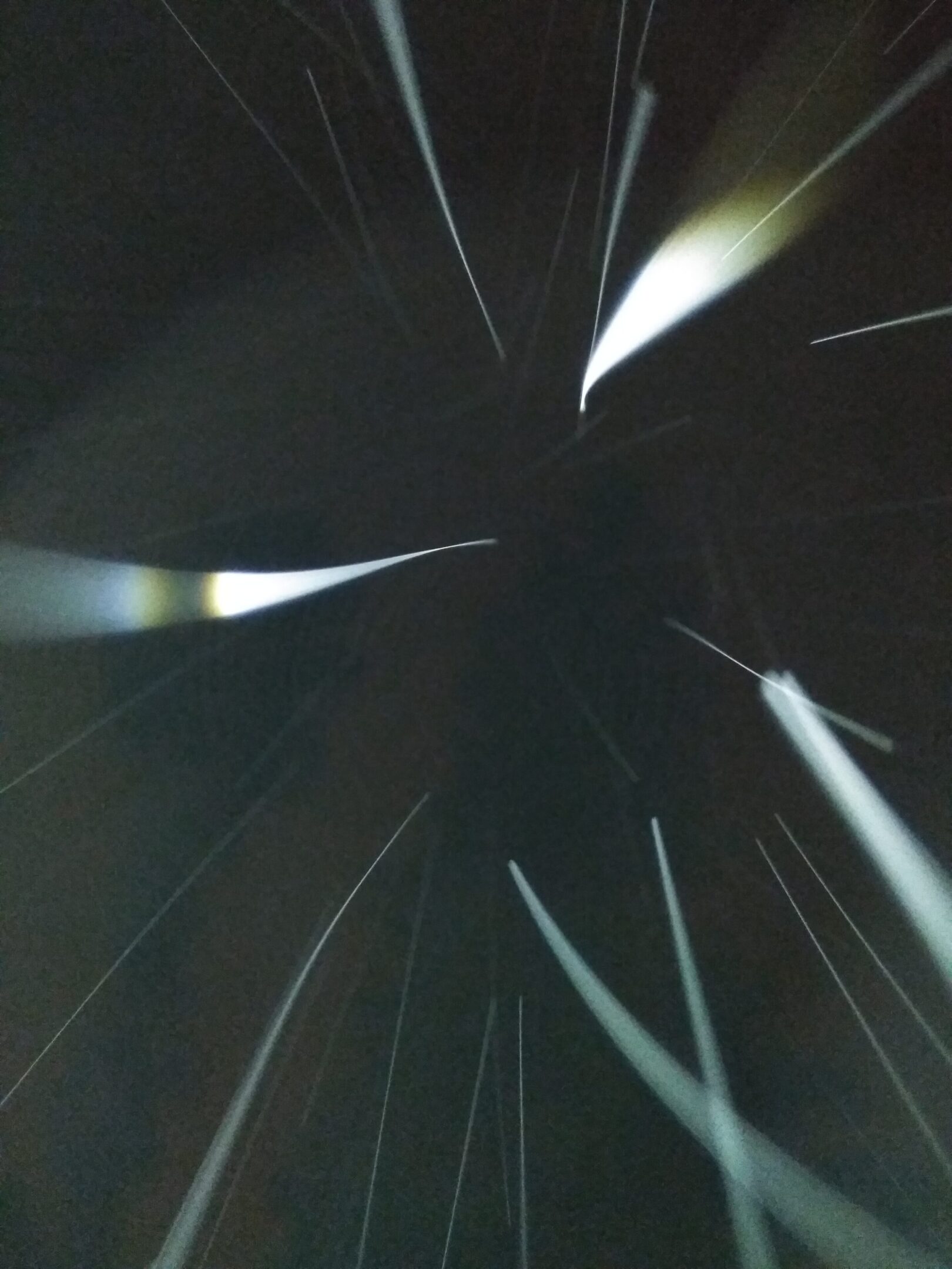 Abstract light streaks on dark background.