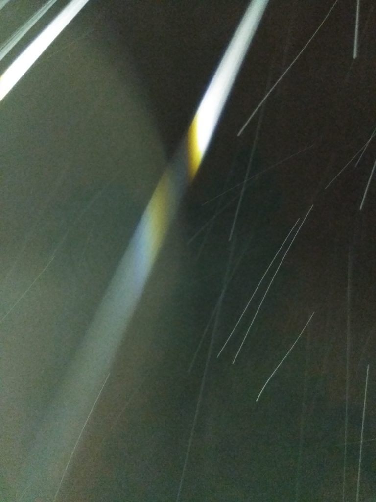 Abstract light streaks in dark background.