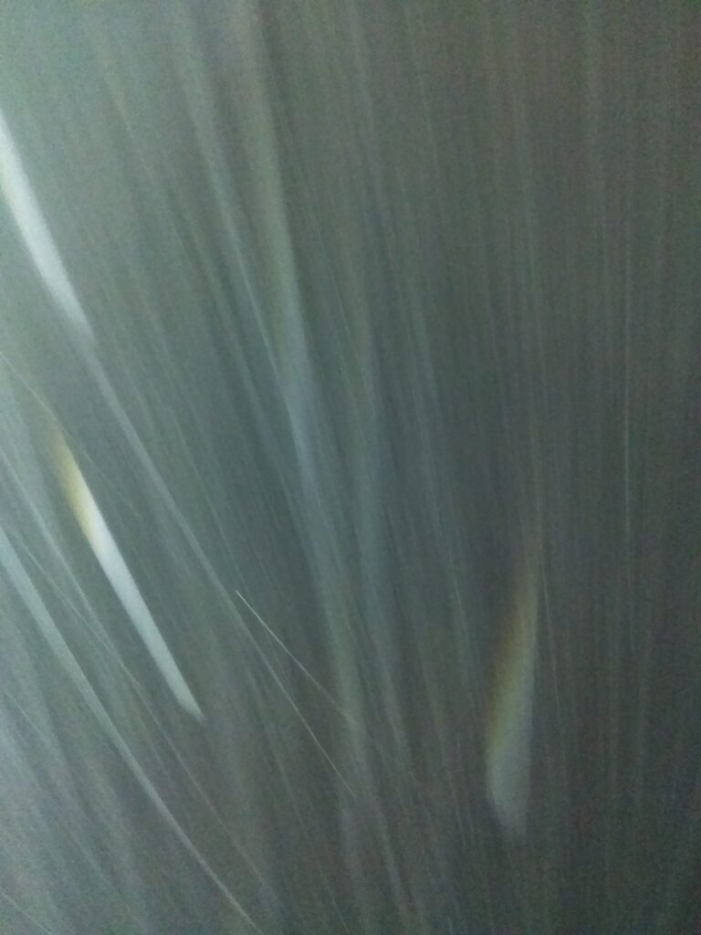 Blurred vertical lines in motion effect.
