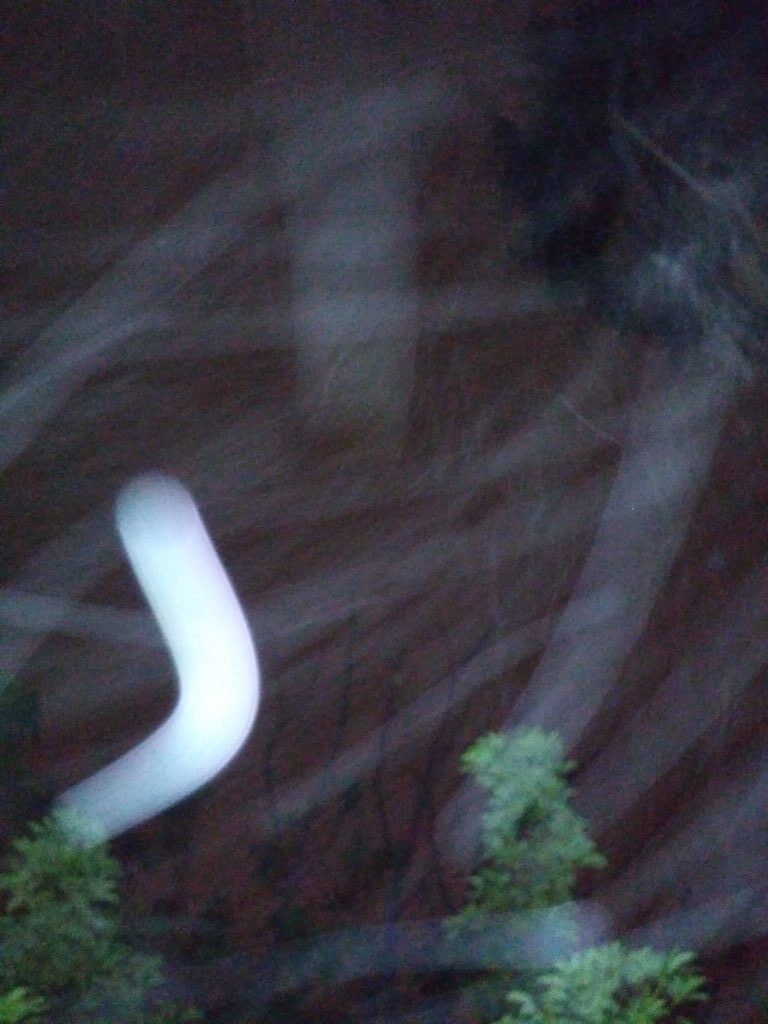 Blurred light trails over dark background.