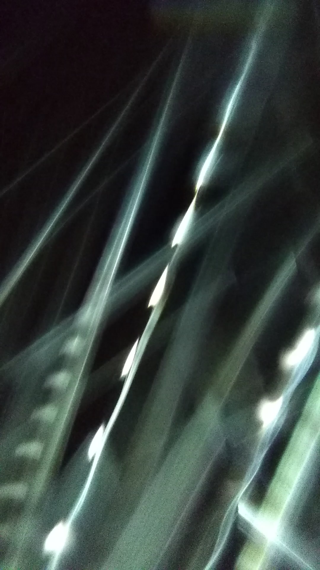 Abstract light streaks on dark background.