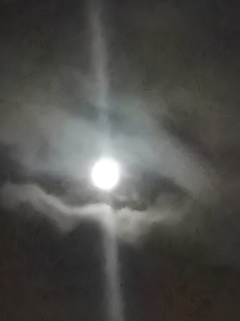 Bright moon surrounded by clouds at night.