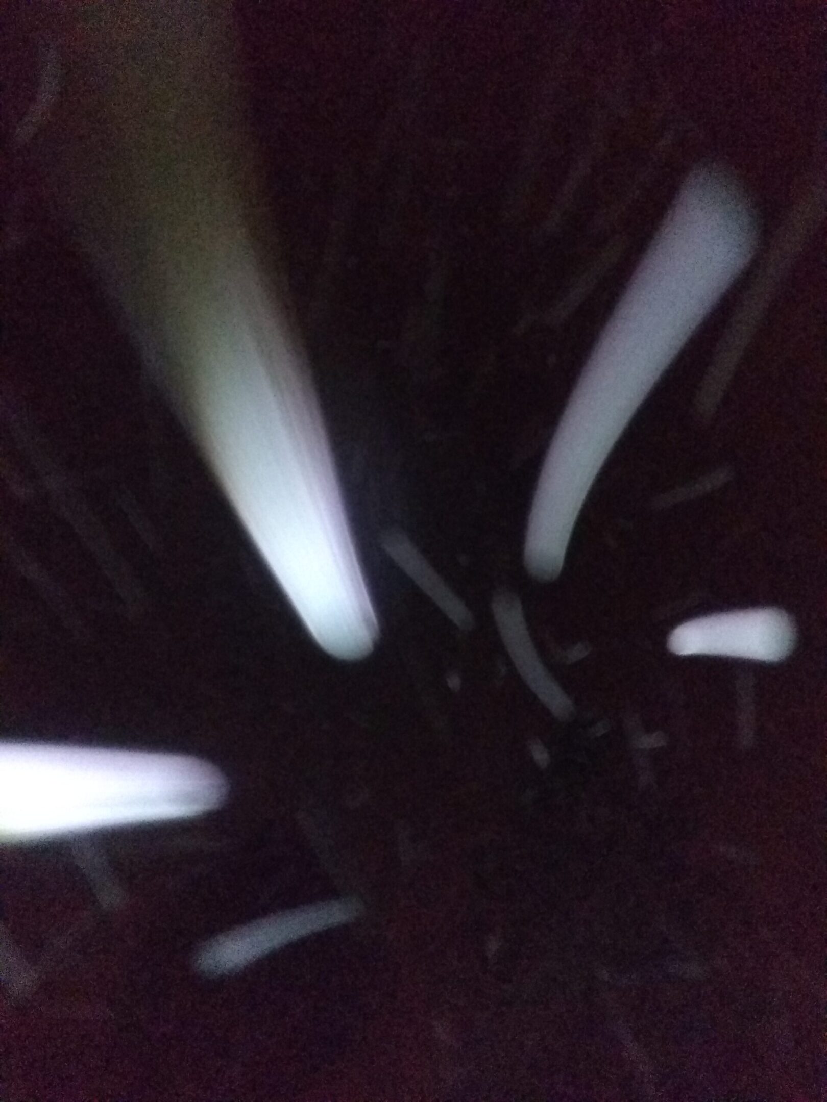 Abstract light streaks on dark background.