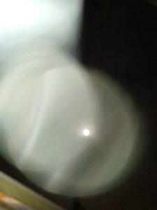 Blurry close-up of a white object.