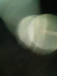 Abstract blurred light circles on dark background.