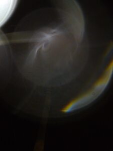 Abstract light and shadow with rainbow hues.