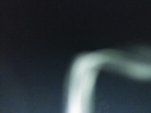 Blurry abstract shape on dark background.