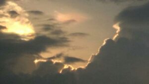 Dramatic clouds with sunlight peeking through.