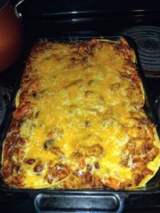 Baked lasagna with melted cheese topping.