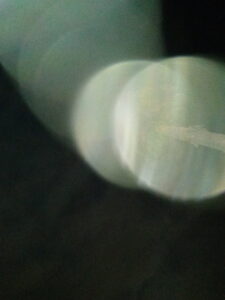 Abstract light circles on a dark background.