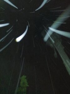 Blurry night sky with streaks of light.