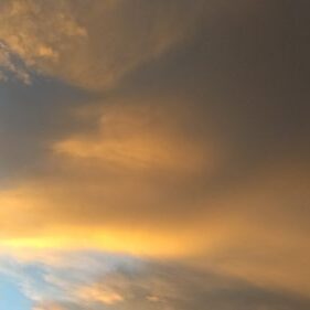 Golden sunset clouds in the sky.