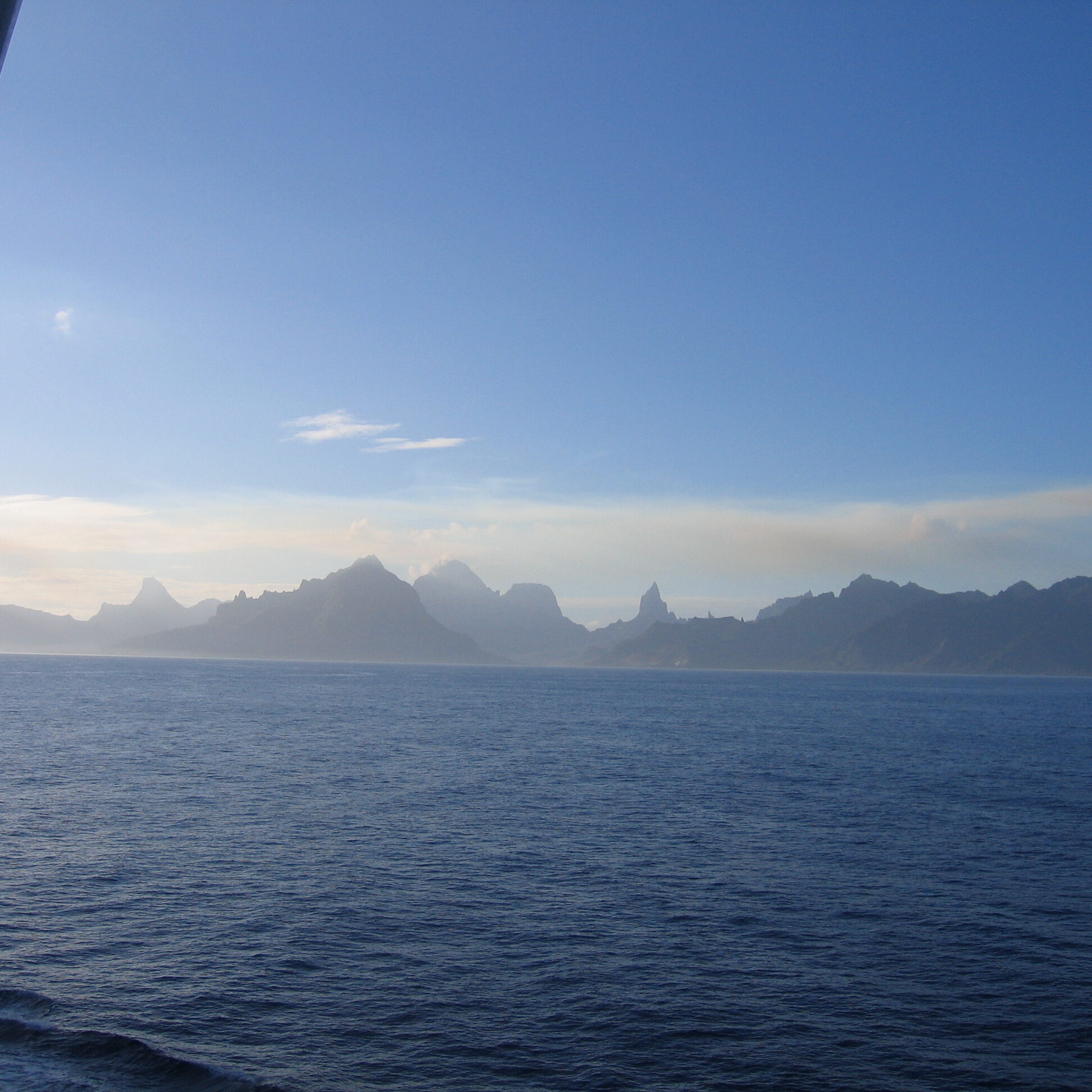 Ocean view with distant mountain silhouette.