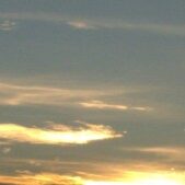 Sunset sky with scattered clouds.