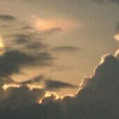 Dramatic clouds with sunlight peeking through.