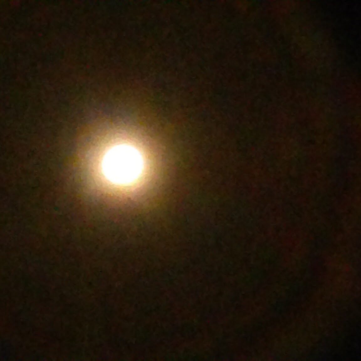 Bright light orb with dark background.