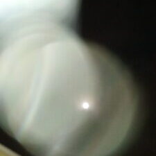 Blurry close-up of a white object.