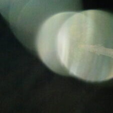 Abstract light circles on a dark background.