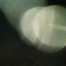 Abstract blurred light circles on dark background.