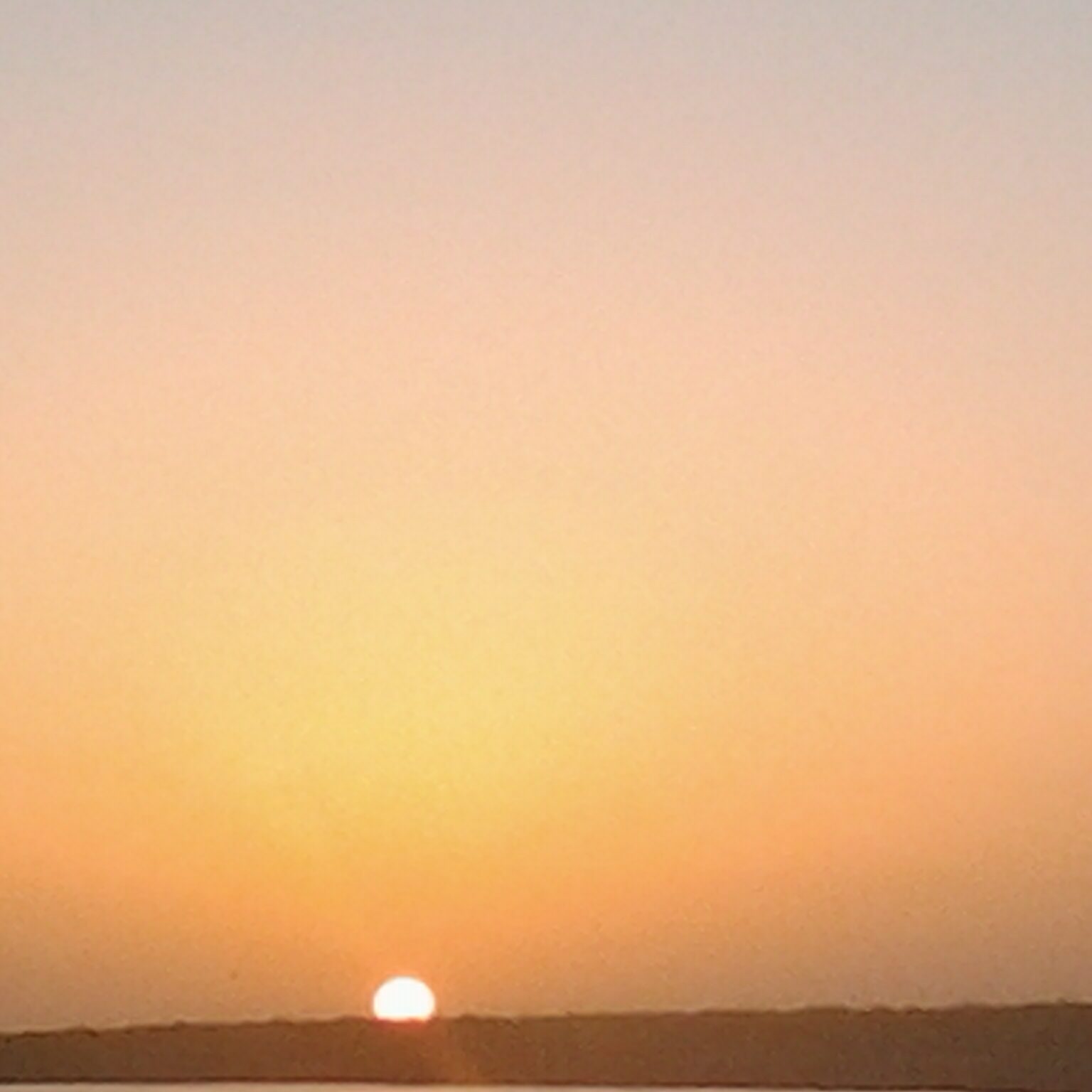Sunset over a calm horizon.