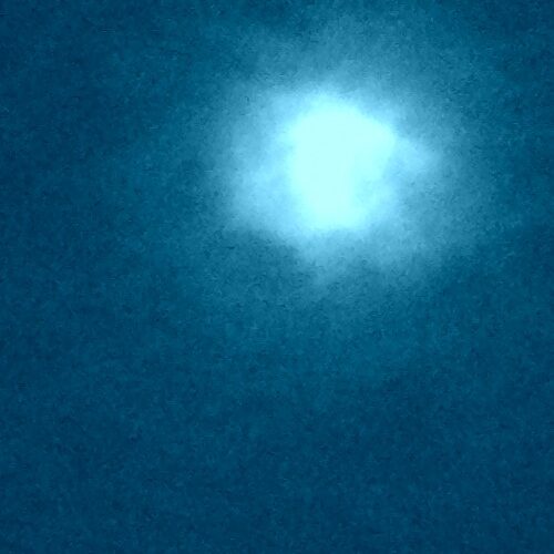 Bright light against a dark blue background.