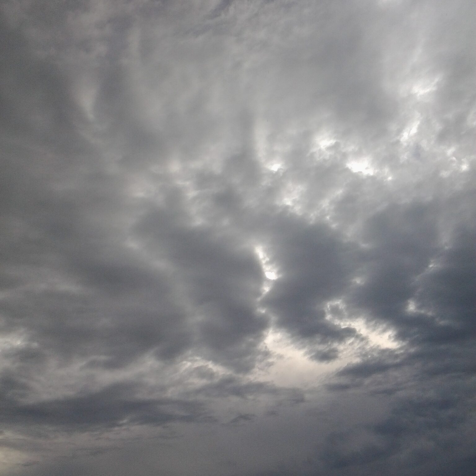 Cloudy sky with dark, dramatic clouds.