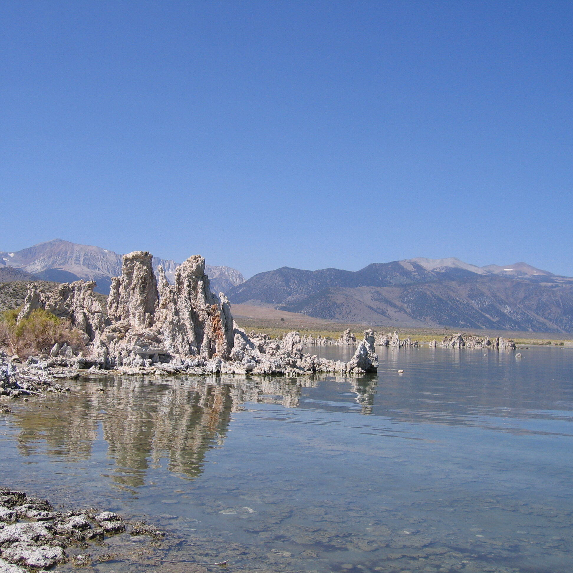 Mono Lake with tufa formations and mountains.