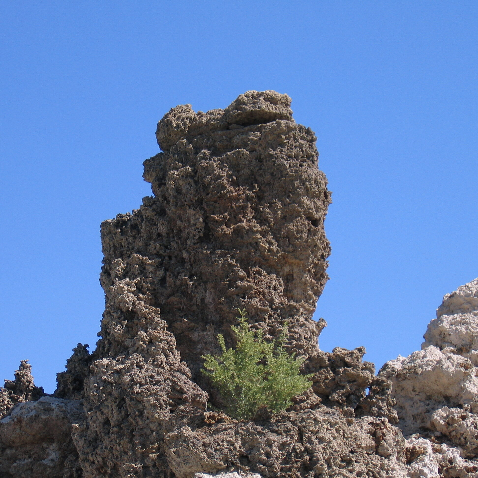 Rock formation under clear blue sky.