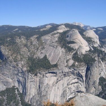 Rocky mountain landscape under clear blue sky.