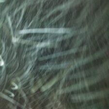 Blurry abstract pattern with light streaks.