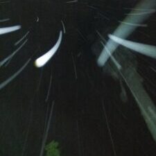 Blurry night sky with streaks of light.