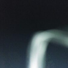 Blurry abstract shape on dark background.