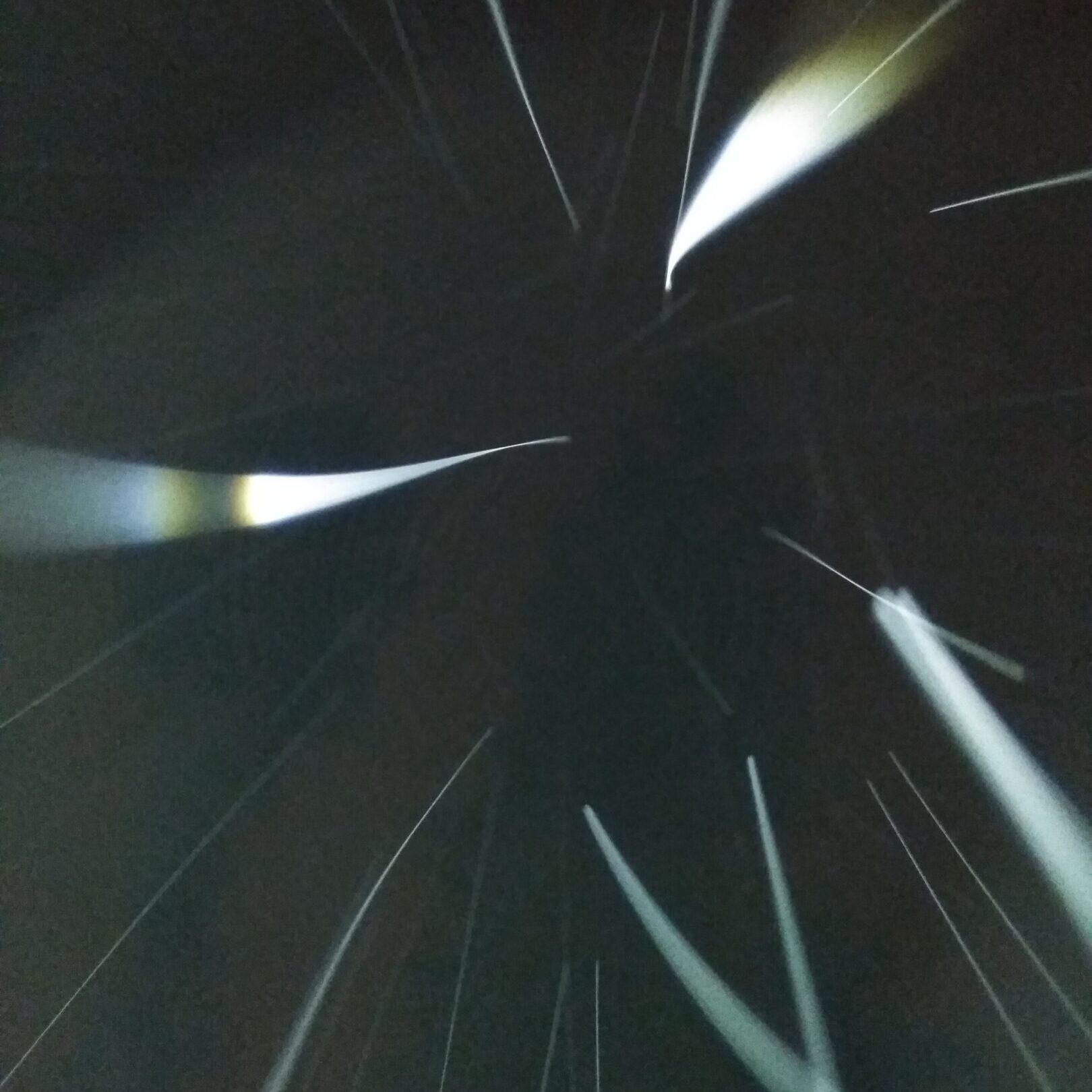 Abstract light streaks on dark background.